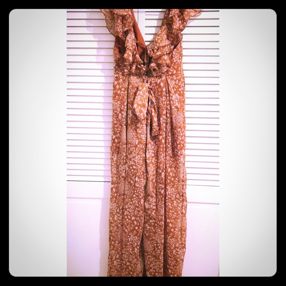Retro floral tan colored ruffle jumpsuit.